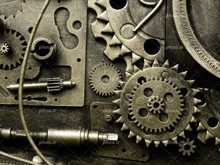 عکس با کیفیت چرخ دنده های قدیمی و زنگ زده در کنار یکدیگر