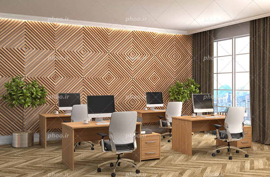 عکس با کیفیت میز های کار و کامپیوتر ها بر روی آن و گلدان های زیبا در کنار میز ها