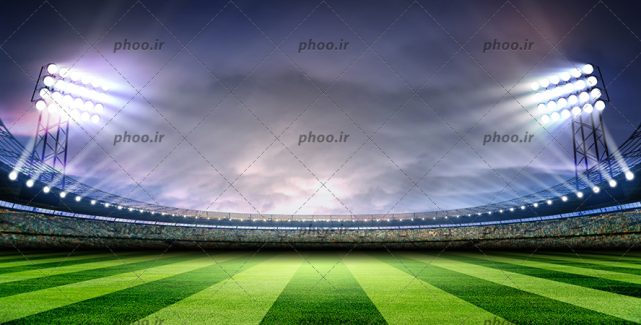 عکس با کیفیت زمین فوتبال در استادیوم بزرگ و نور پردازی هایی بر روی زمین