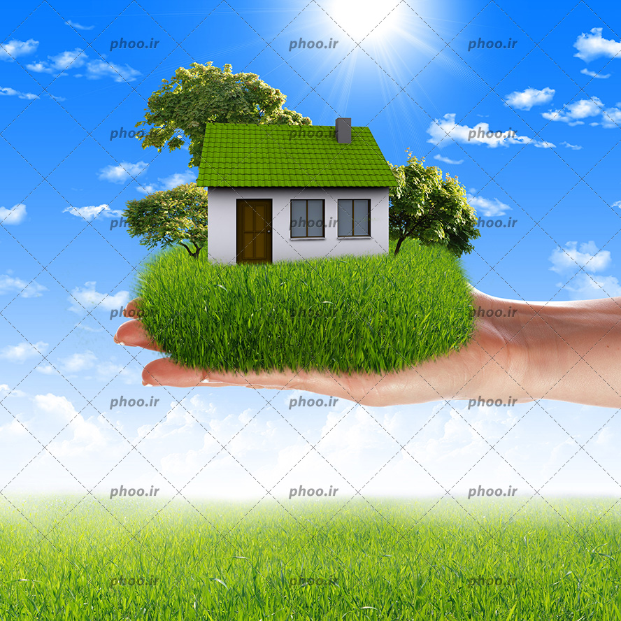 عکس با کیفیت پس زمینه طبیعت زیبا و دست زن با خانه ای با فضای سبز در کنارش بر روی دست