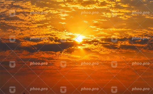 غروبِ زرین در آغوشِ ابرها
