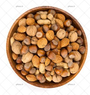 عکس با کیفیت آجیل تازه در ظرف چوبی بسیار زیبا از نمای بالا