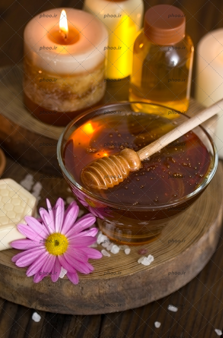 عکس روغن و عسل و شمع ها برای ماساژ