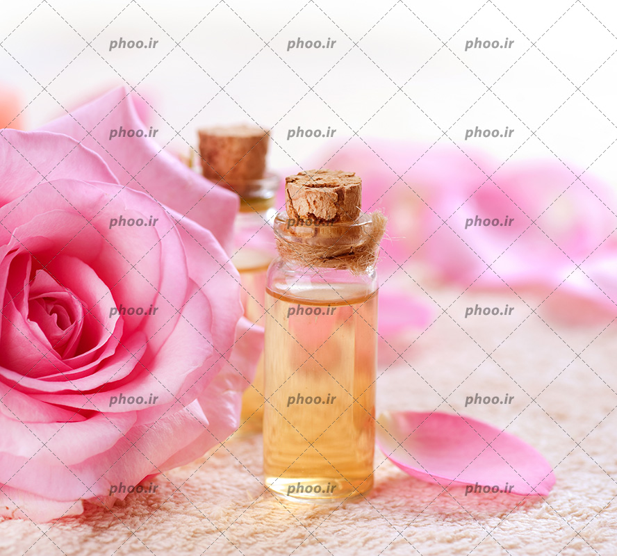 عکس بطری های روغن و گل برای آروماتراپی