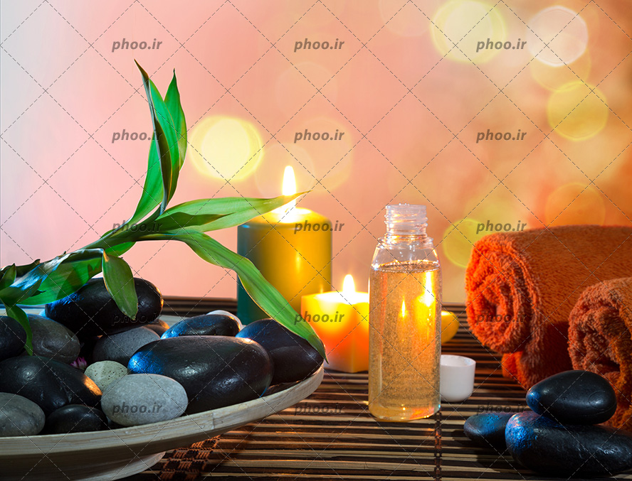 عکس شمع و حوله آماده سازی برای ماساژ