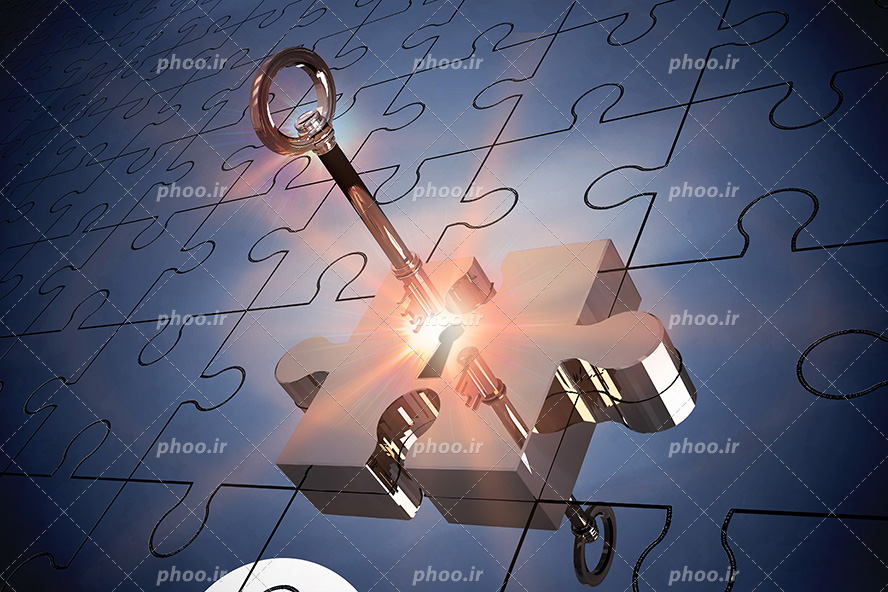 عکس با کیفیت کلید نورانی در حال باز کردن قطعه ای پازل
