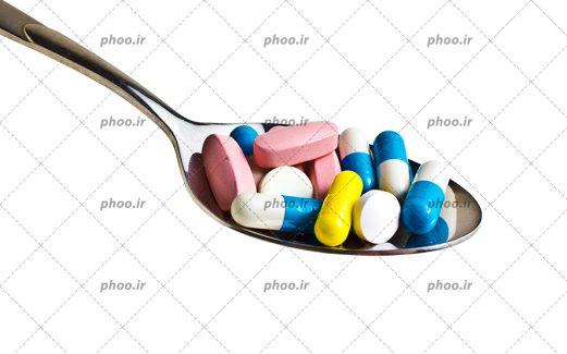 عکس قرص های رنگارنگ کپسول در قاشق