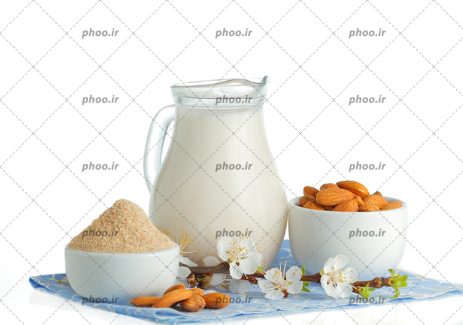 عکس پارچ شیر و بادام ها در زمینه سفید