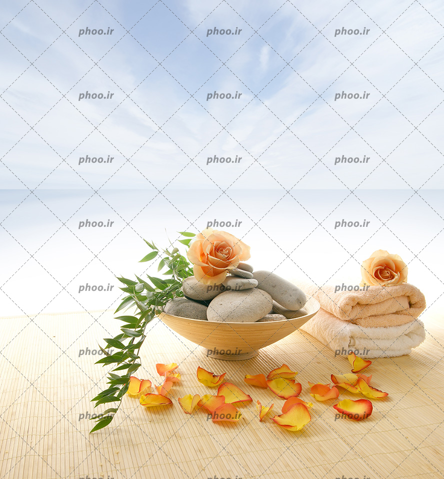 عکس زیبا سنگ و حوله با گل واسه ماساژ