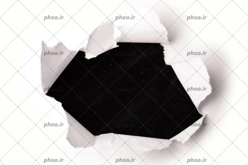 عکس دیوار کاغذی پاره شده و سیاهی و تاریکی درون آن
